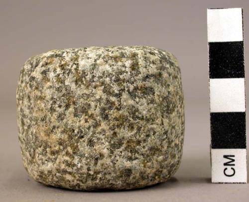 Ground stone cylinder with indented ends