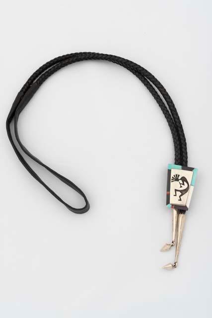 Bolo tie of Flute Player overlay framed by inlaid border