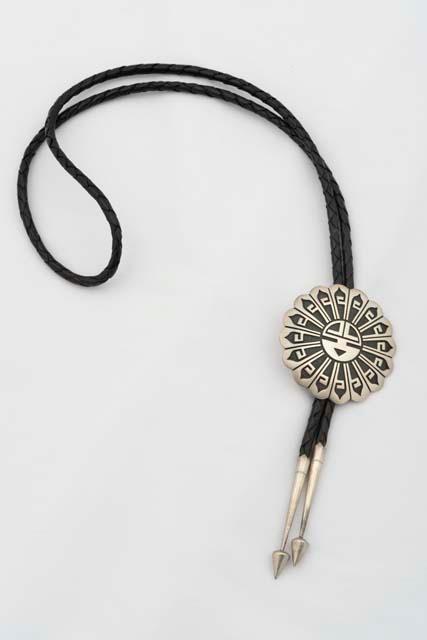 Silver overlay bolo tie of Sun Face