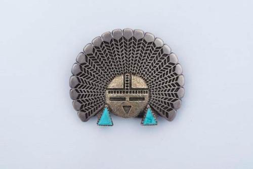 Cast silver belt buckle of Sunface set with turquoise