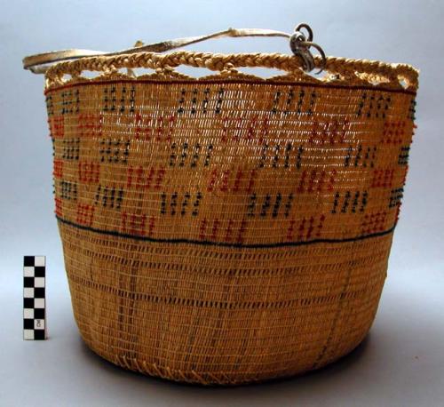 Cylindrical basket with hide thongs