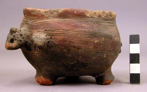 Vessel, with three legs.  Incised decoration.