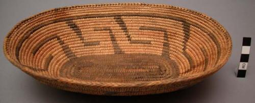 Oval basket, coiled. Geometric designs.