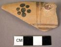 Rim potsherd with handle fragment