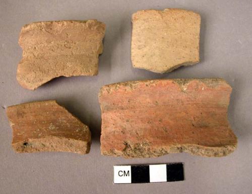 7 rim potsherds - plain coarse ware, red surfaced, low burnish