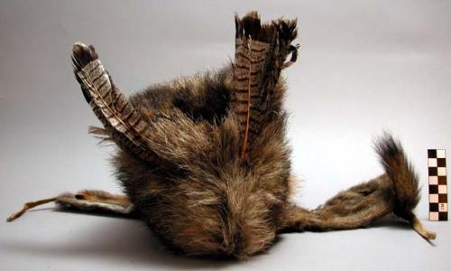 Winter cap of marmot skin, feathers of ruffed grouse and squirrel.