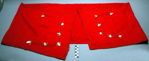 Man's long breech clout of red cotton cloth. Embroidered with flower designs in silk.