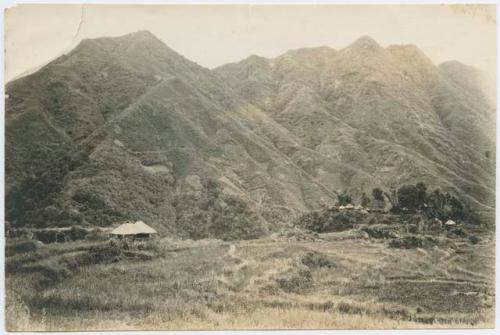 Structures in front of a mountain landscape