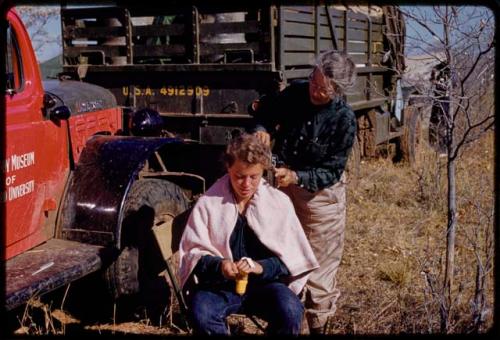 Lorna Marshall cutting Elizabeth Marshall Thomas' hair