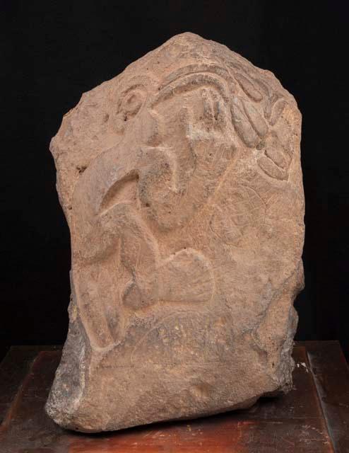 Stone with carved figure