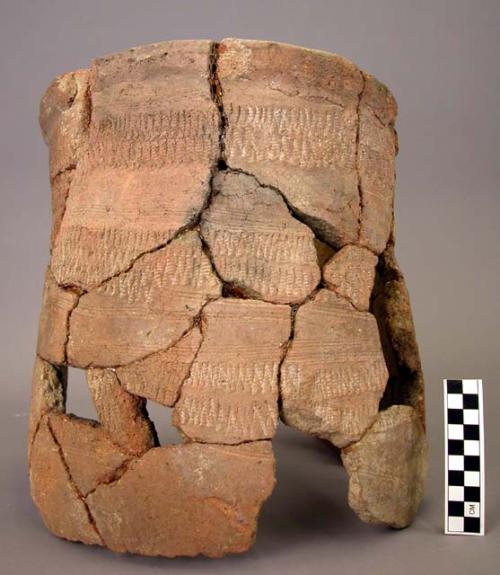 Half of large heavy jar; horizontal bands between rows of incised lines