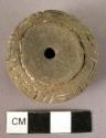 Pottery spindle whorl with incised and colored designs