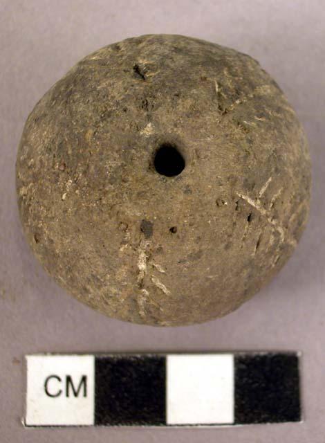 Pottery spindle whorl with incised and colored designs