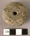 Pottery spindle whorl with incised and colored designs