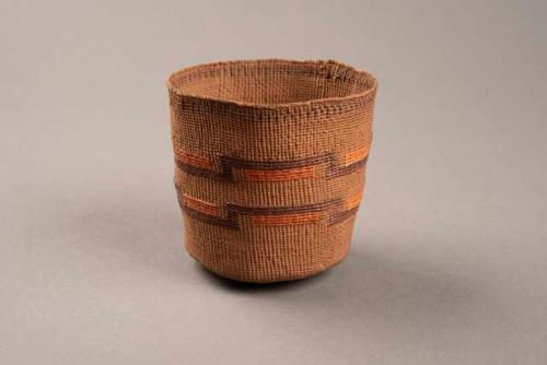 Small basket of very fine twined weave - orange and brown designs