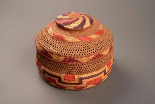 Wrapped twine basket with rattle in cover - colorful designs in false embroidery