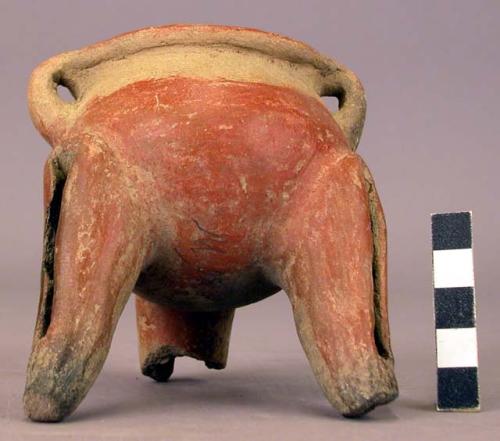 Pottery dish, tripod, legs hollow with clay balls