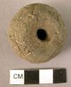 Pottery spindle whorl with incised bird design