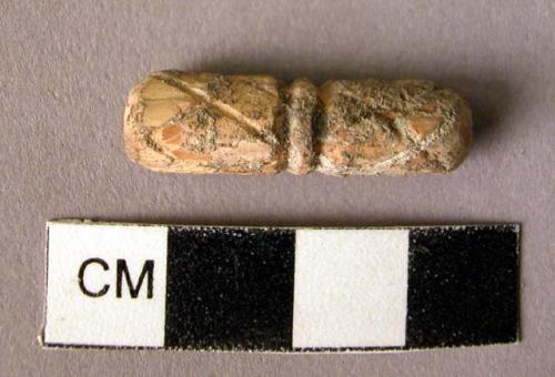 Bone or ivory bead with incised designs