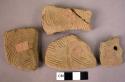 6 wavy-line ware sherds - 1 perforated