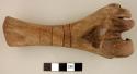 Distal end humerus of animal - carved to represent claw of bird