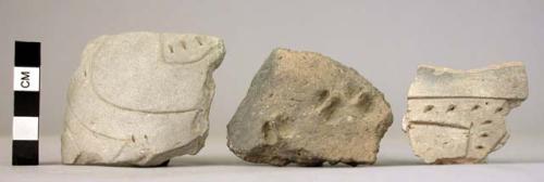 Ceramic rim & body sherds, incised, punctate, finger tip des, fire clouded