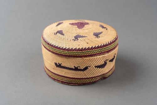 Twined bowl-shaped grass basket (A) with lid (B); boat and bird motif