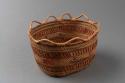 Miniature wrapped twined grass basket (A) with lid (B); whaling scene motif