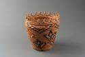 Coiled cylindrical basket of cedar root, straw, and fern stem: leaf motif