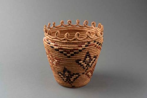 Coiled cylindrical basket of cedar root, straw, and fern stem: leaf motif