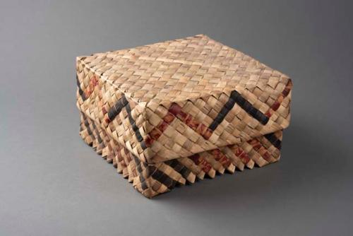 Rectangular basketry box. Decorated with red and black zigzag lines. +