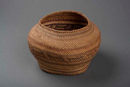 Makah closed wrap twined basket. Bottom of basket is plaited w/ cedar bark and i