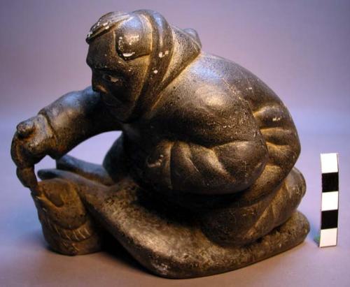 Stone carving - man with fish