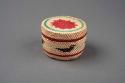 Small basket with designs in red, green, and black - cedar bark bottom