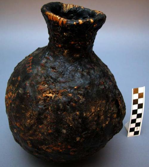 Medium-sized water jug, basket work. Made of bear grass and coated in pine pitc