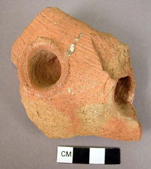 Red potsherd with tunnel handle