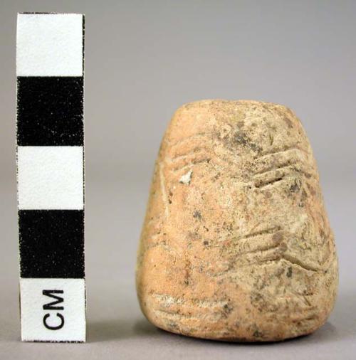 Spindle whorl with incised geometric design 3.4 cm diameter x 3.7 cm. h.