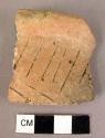 Rim potsherd - coarse incision