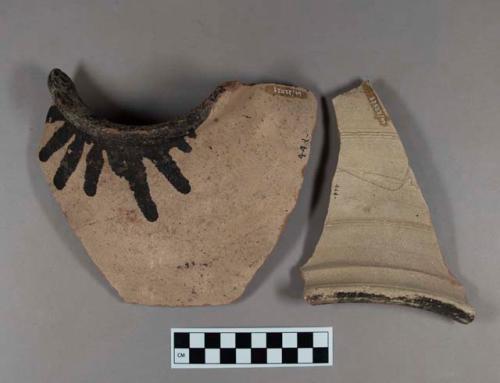 Ceramic, coarse earthenware rim sherds, both with interior black slip, one with incised exterior decorations