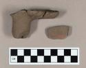 Ground stone, elbow pipe fragments, incised