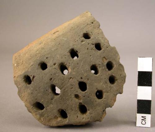 Sherd of collander of black hand smoothed ware