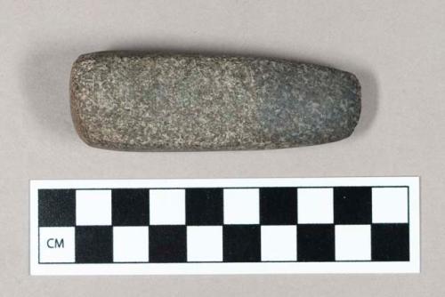 Ground stone axe.