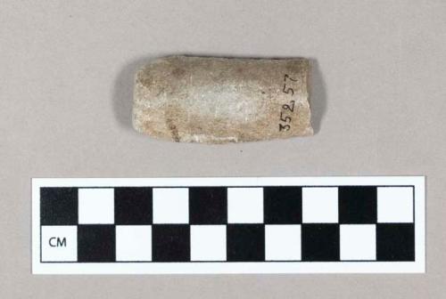 Ground stone pipe fragment, tubular.