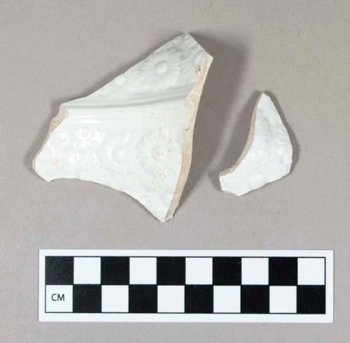 Ceramic, whiteware body sherd with embossed floral decoration on interior