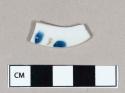 Ceramic, porcelain body sherd with blue underglaze and gold overglaze