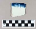 Ceramic, pearlware rim sherd with blue cord and herringbone edge decoration