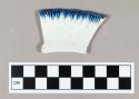 Ceramic, pearlware rim sherd with blue shell edge decoration