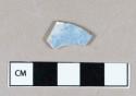 Ceramic, whiteware body sherd with blue sponge decoration