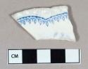 Ceramic, whiteware rim sherd with blue transferprint and molded rim