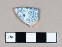 Ceramic, whiteware rim sherd with blue transferprint and molded exterior